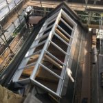 Pitched roof light installed above the kitchen floods the room with light and heightens the room. 